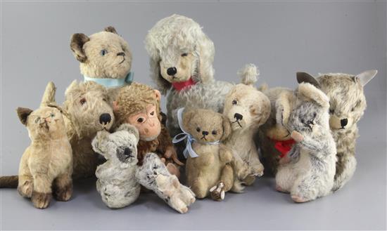 Thirteen soft toys: dogs, cats, monkey, 1930s-50s, tallest 10in.